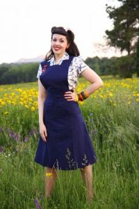 Jitterbuggin has a great jumper/pinafore that's similar to the one Irene Thomas is wearing in the clip.