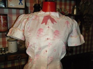 And it looks like Time Machine Vintage has Kay's number - Kay's shirt is a little harder to discern, but it looks like a button-down with some sort of tie at the neck.  Request in white sans lace for your Groovie Movie homage.