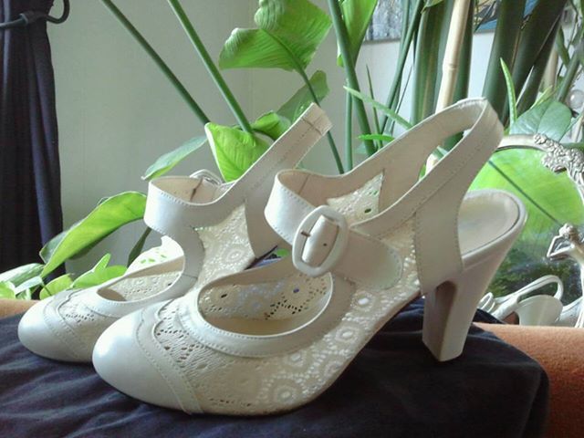 Re-mix Ginger heels in ivory, size 9, worn once, $165.00 starting bid - still a bit pricey for used shoes, but maybe the seller will consider lower offers?