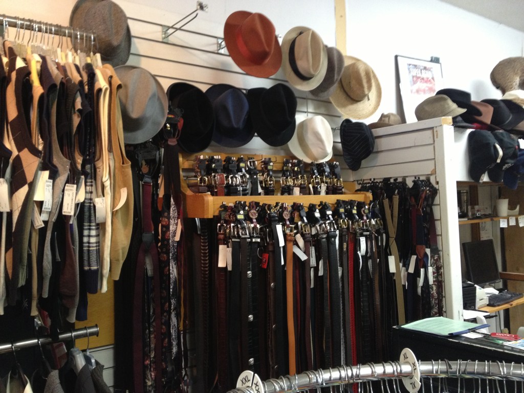 Men's accessories overflowing from the racks at the Gentleman's Closet.